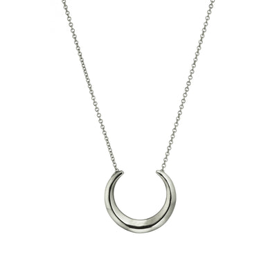 The Torc silver necklace is crafted using solid sterling silver chain & pendant. Handmade by the Irish jewellery designer, the Torc collection is a modern twist on the 'Torc' neck collars from the Bronze Age found in The National Museum of Ireland. This necklace is perfect for everyday wear, paired up with a plain top.