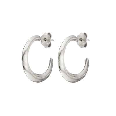 Torc hoop silver earrings is created using solid sterling silver. Handmade by the Irish jewellery designer, the Torc collection is a modern twist on the 'Torc' neck collars from the Bronze Age found in the The National Museum of Ireland. These statement earrings are perfect for everyday wear and into the evening.