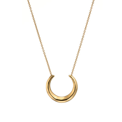Gold Torc Necklace is a modern take on Bronze Age Torc collars, featuring a polished Torc pendant on a cable chain - handmade Irish Celtic jewellery.