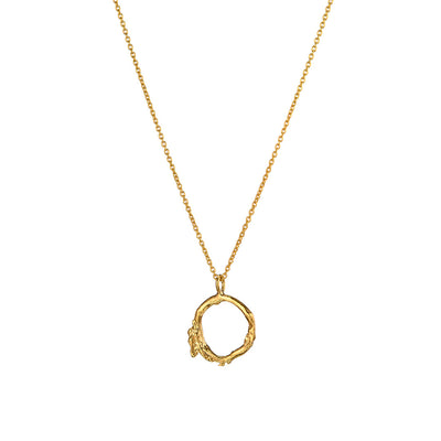 The Gold Twig Necklace, cast from a Gorse bush twig, features a delicate circular pendant. This modern Irish necklace makes a unique gift from Ireland