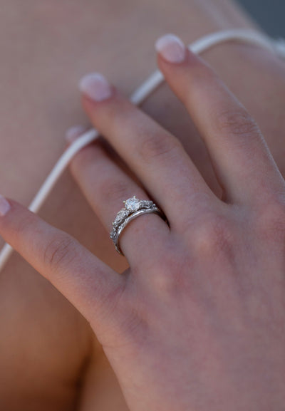 Close-up of a hand wearing a 14ct White gold ring with a Lab-grown diamond, made in Ireland and is inspired by the gorse bush.